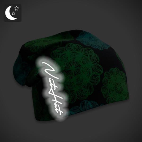 Musta trikoopipo vihreällä väriloiste kukkakuosilla ja heijastavalla logolla